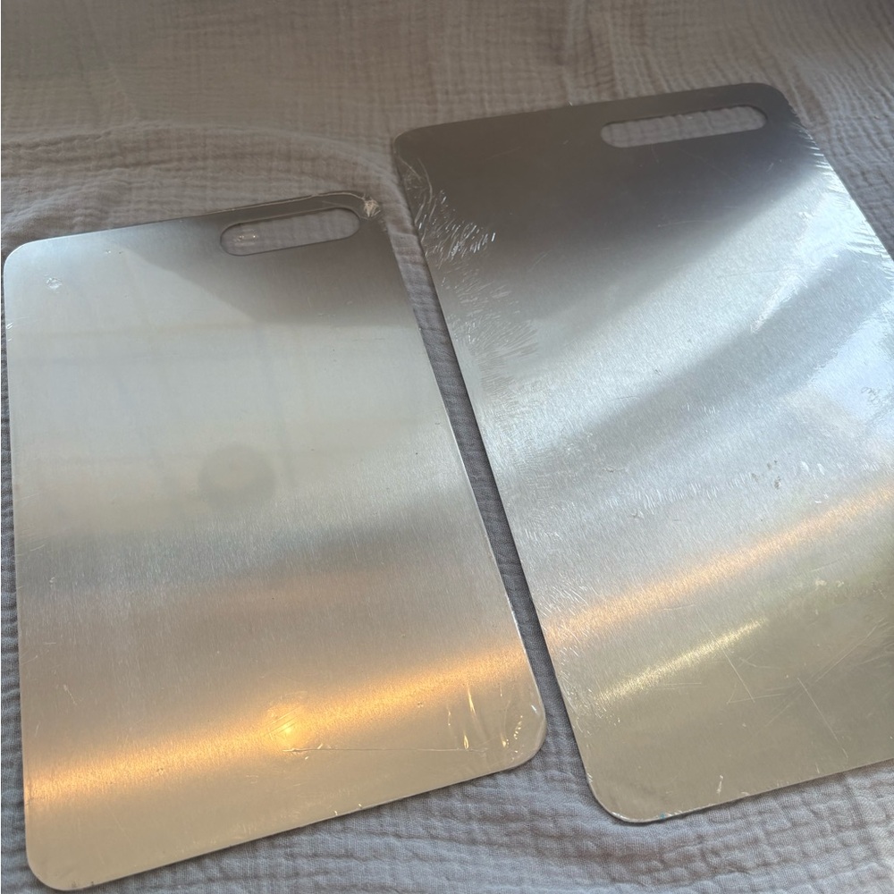 2 SIROV titanium cutting boards, current value $70
